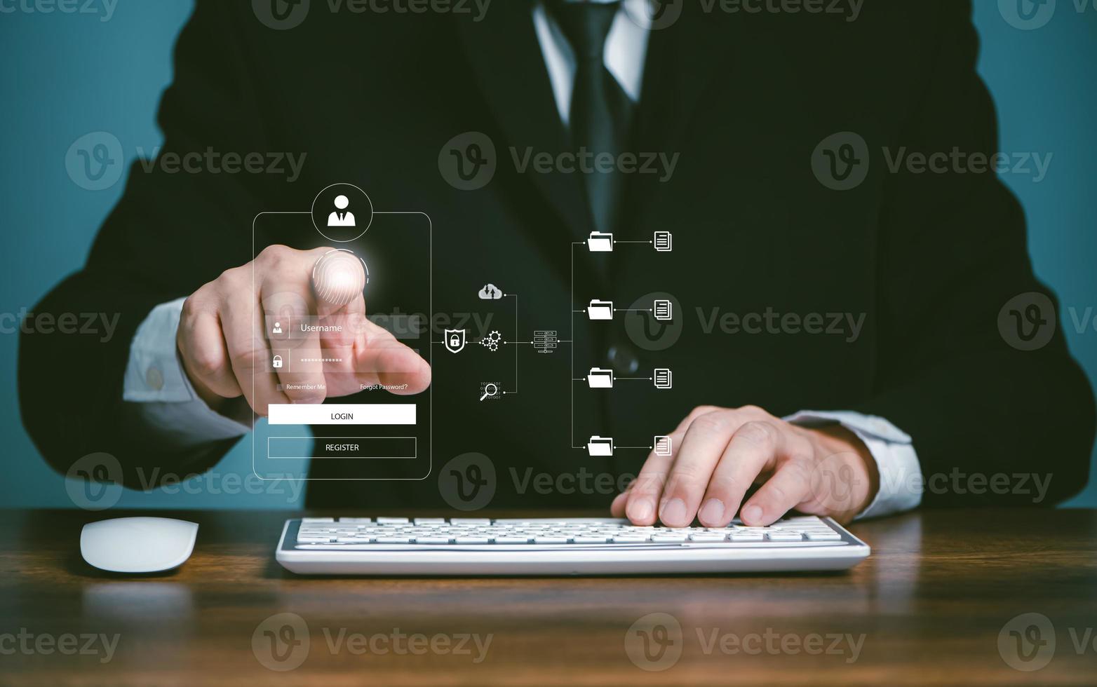 Cybersecurity cloud network systerm privacy protect data concept, Businessman using computer and touching fingerprint to scan the protection system cyber security login user. photo
