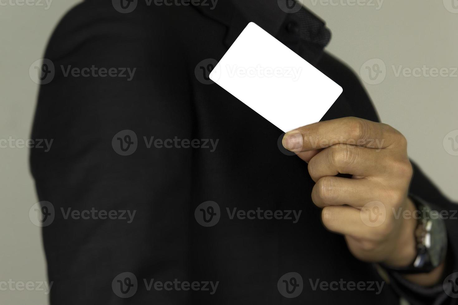 hand holding white card close up for white card concept design on white background. photo