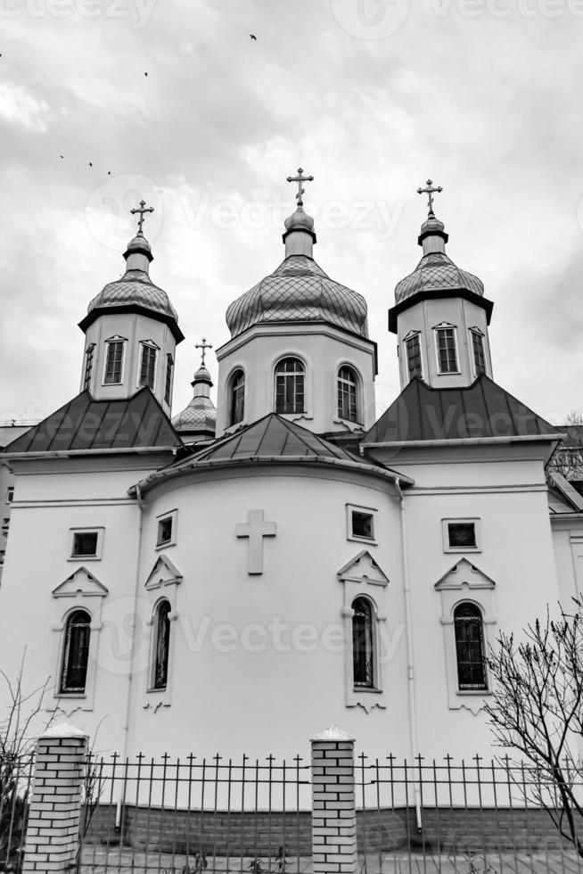 Christian church cross in high steeple tower for prayer photo
