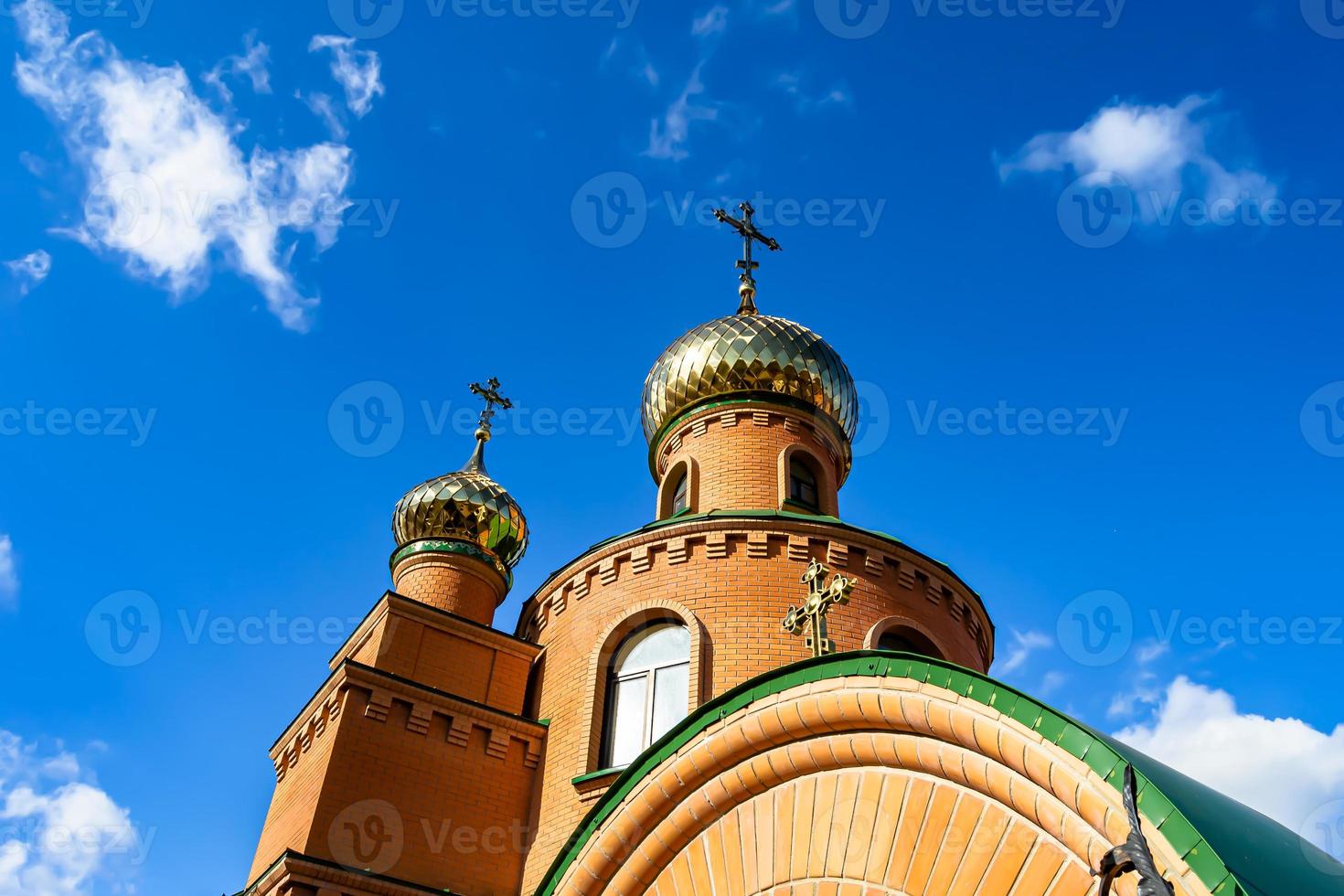 Christian church cross in high steeple tower for prayer photo