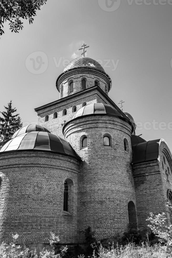 Christian church cross in high steeple tower for prayer photo