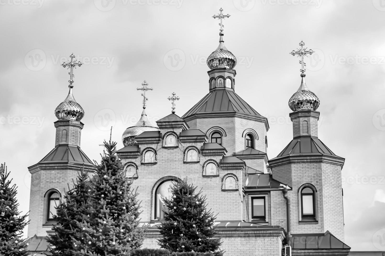 Christian church cross in high steeple tower for prayer photo