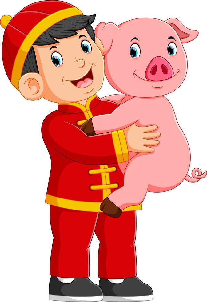 a little boy Is playing with a pig in the chinese new year vector