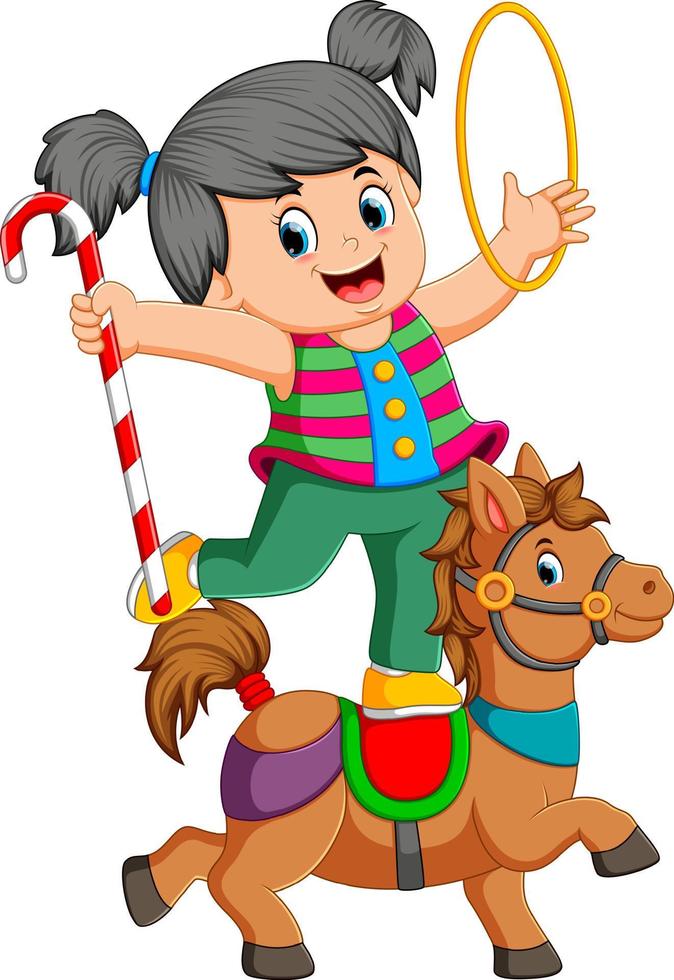 una niña está jugando con el anillo y el bastón de caramelo en el caballo del circo vector