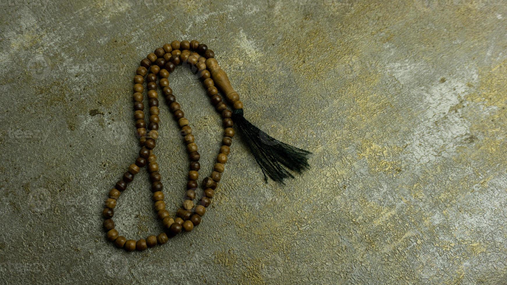 wooden tasbih beads isolated. islamic prayer beads photo