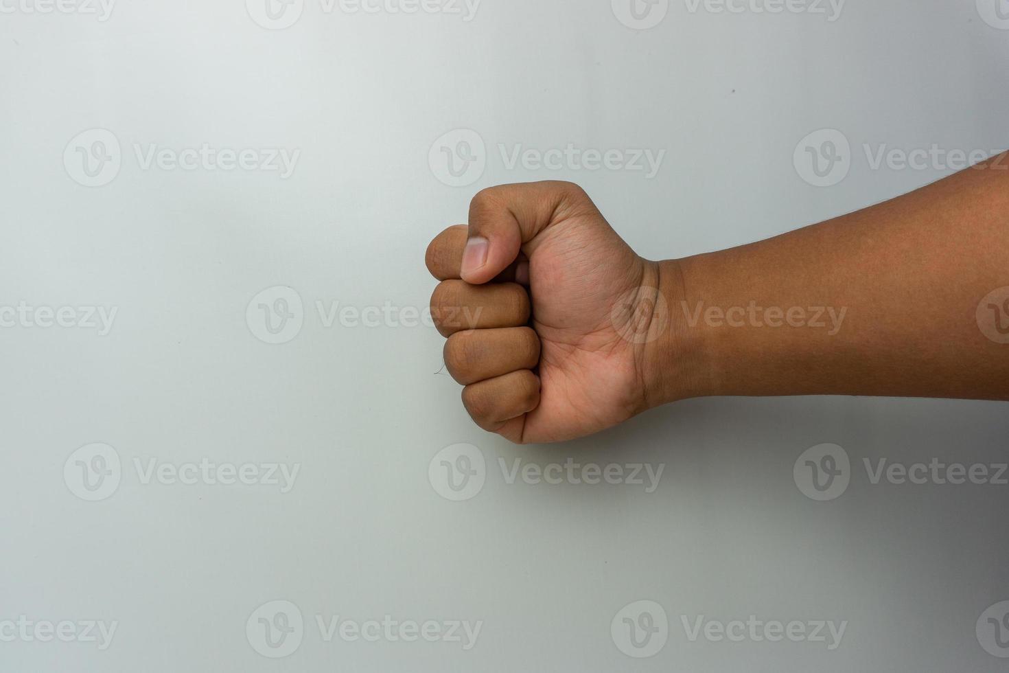 clenched fist isolated. male hand punching gesture photo