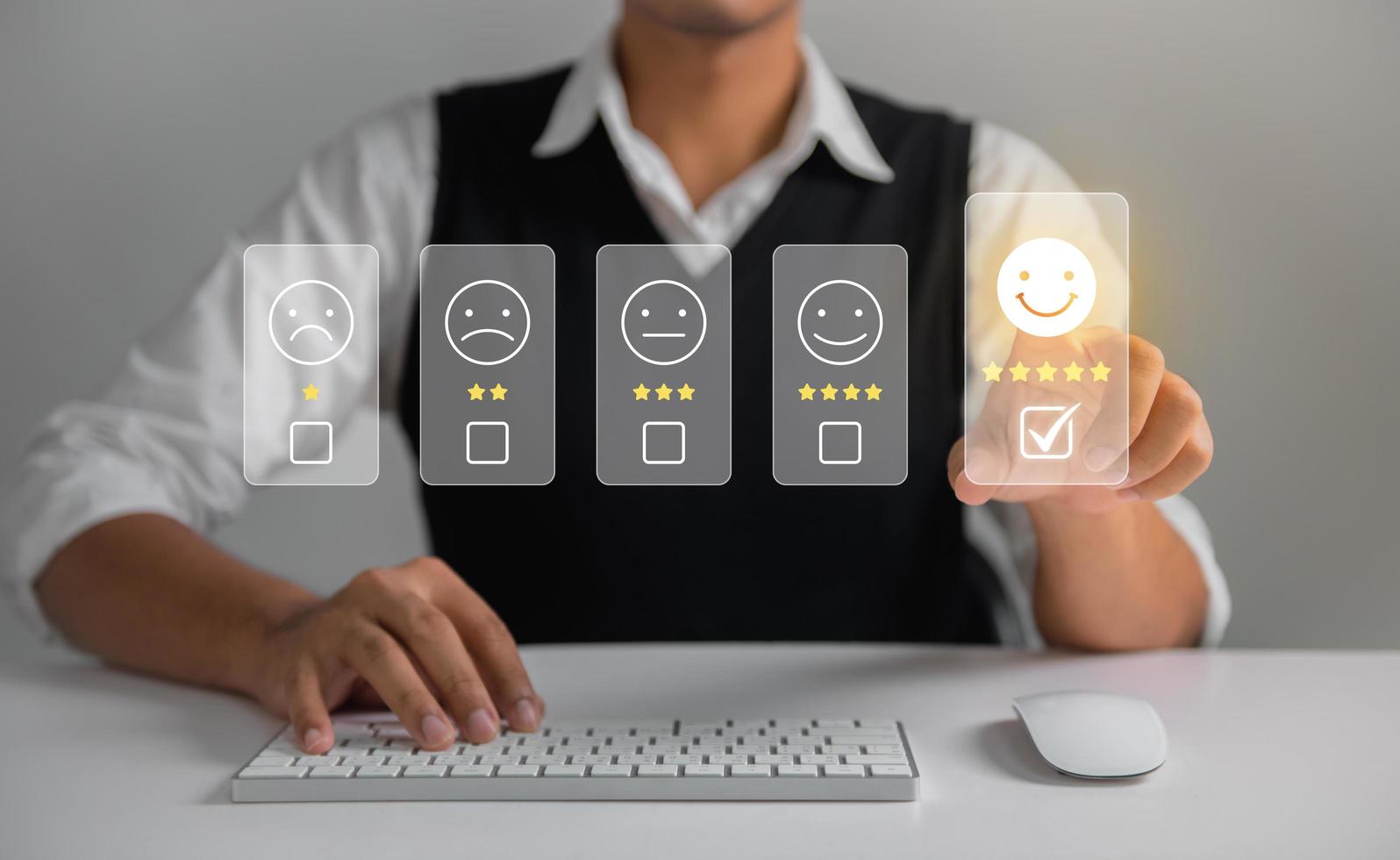 Businessman pressing face emoticon rating on virtual touch screen to service experience. Customer service and Satisfaction concept. photo