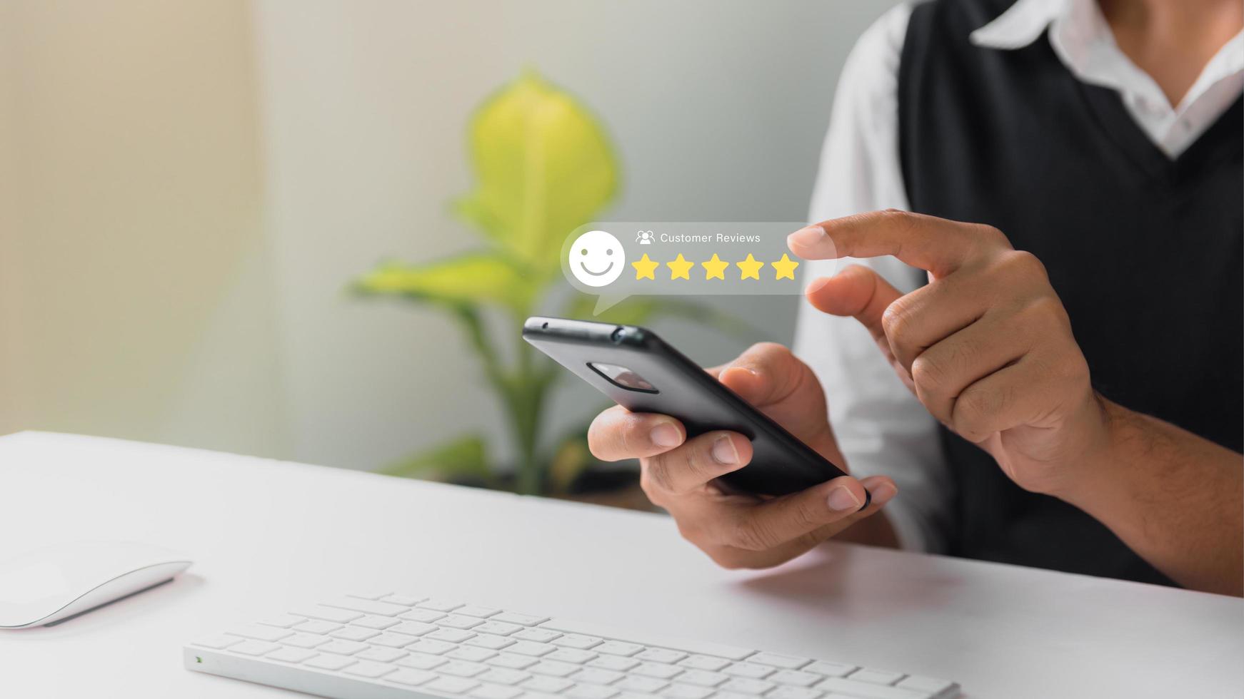 Businessman pressing face emoticon rating on virtual touch screen to service experience. Customer service and Satisfaction concept. photo