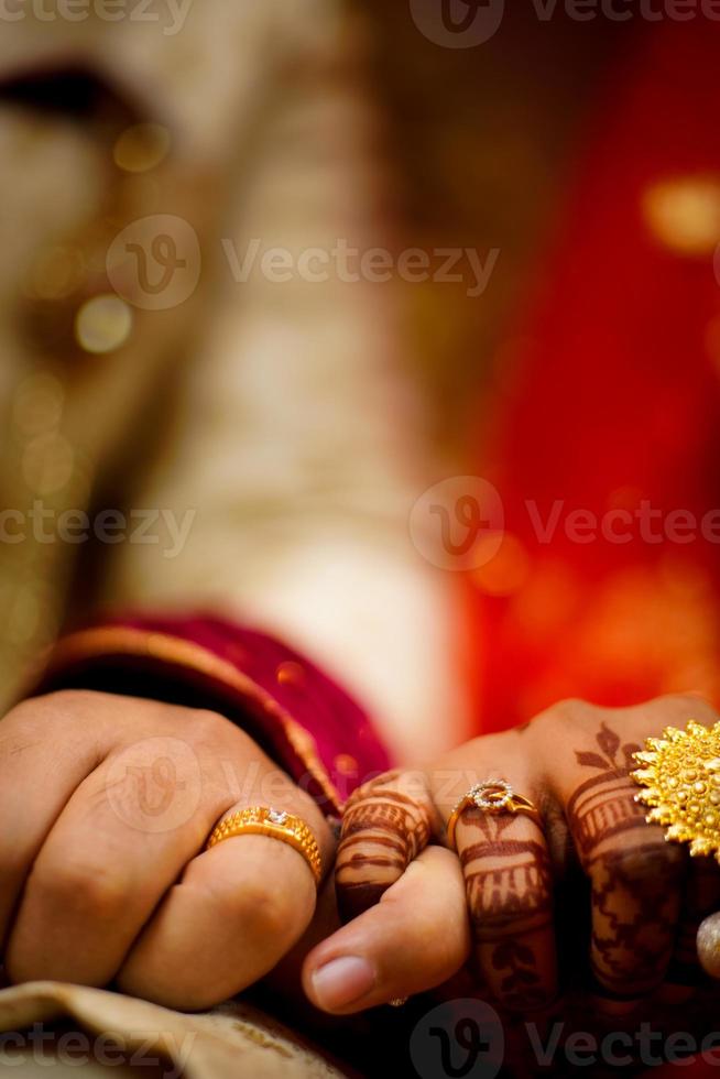 Traditional engagement ring on bride hand photo