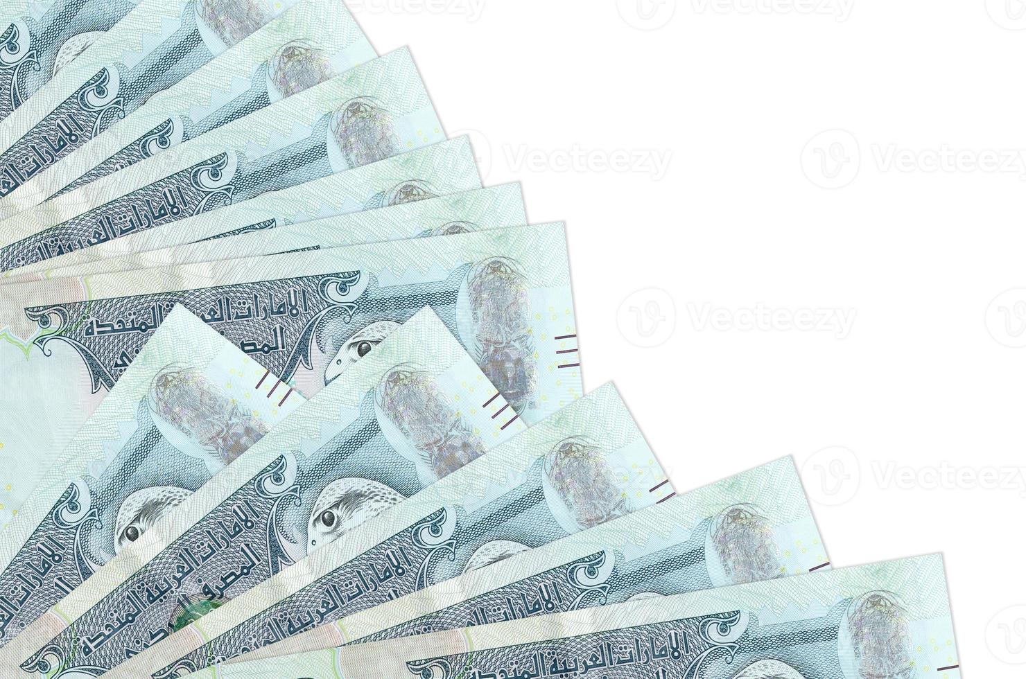 500 UAE dirhams bills lies isolated on white background with copy space stacked in fan close up photo