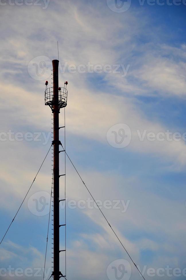 Chimney steam pipe of industrial manufacturing plant under the blue sky photo