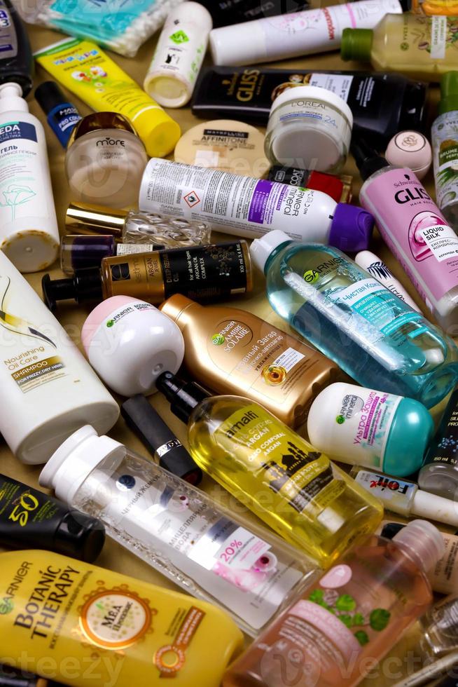 KHARKOV, UKRAINE - JANUARY 2, 2021 Many used bottles and jars for different brandy feminines. Containers for shampoo and lotions, cans for creams and masks photo