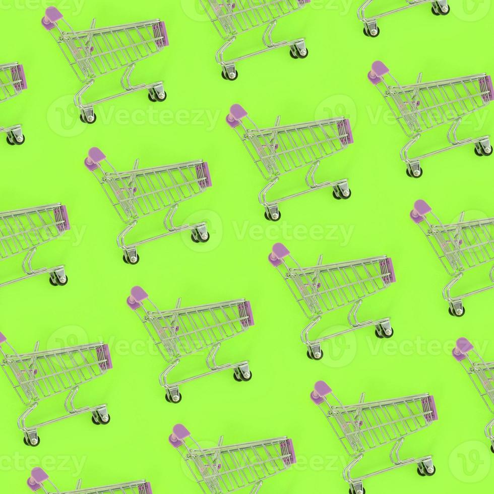 Shopping addiction, shopping lover or shopaholic concept. Many small empty shopping carts perform a pattern on a pastel colored paper background. Flat lay composition, top view photo