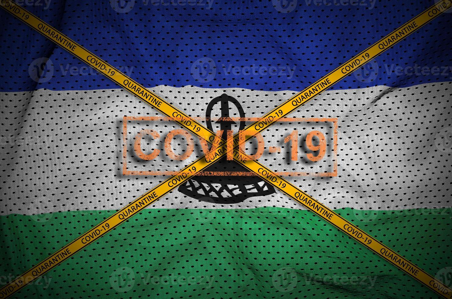Lesotho flag and Covid-19 stamp with orange quarantine border tape cross. Coronavirus or 2019-nCov virus concept photo