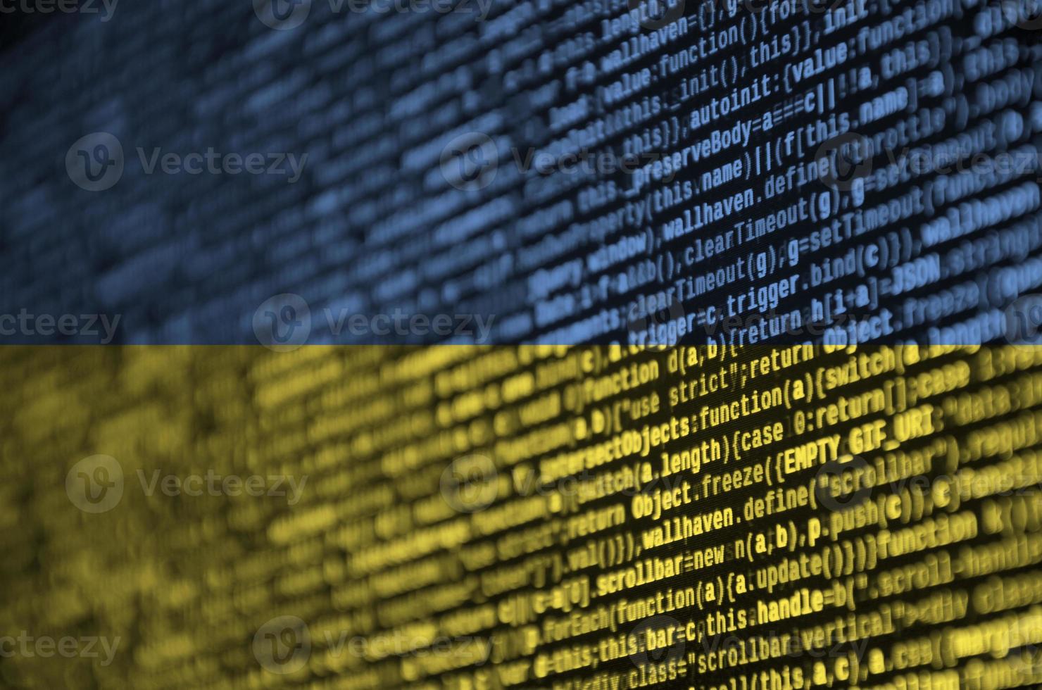 Ukraine flag is depicted on the screen with the program code. The concept of modern technology and site development photo