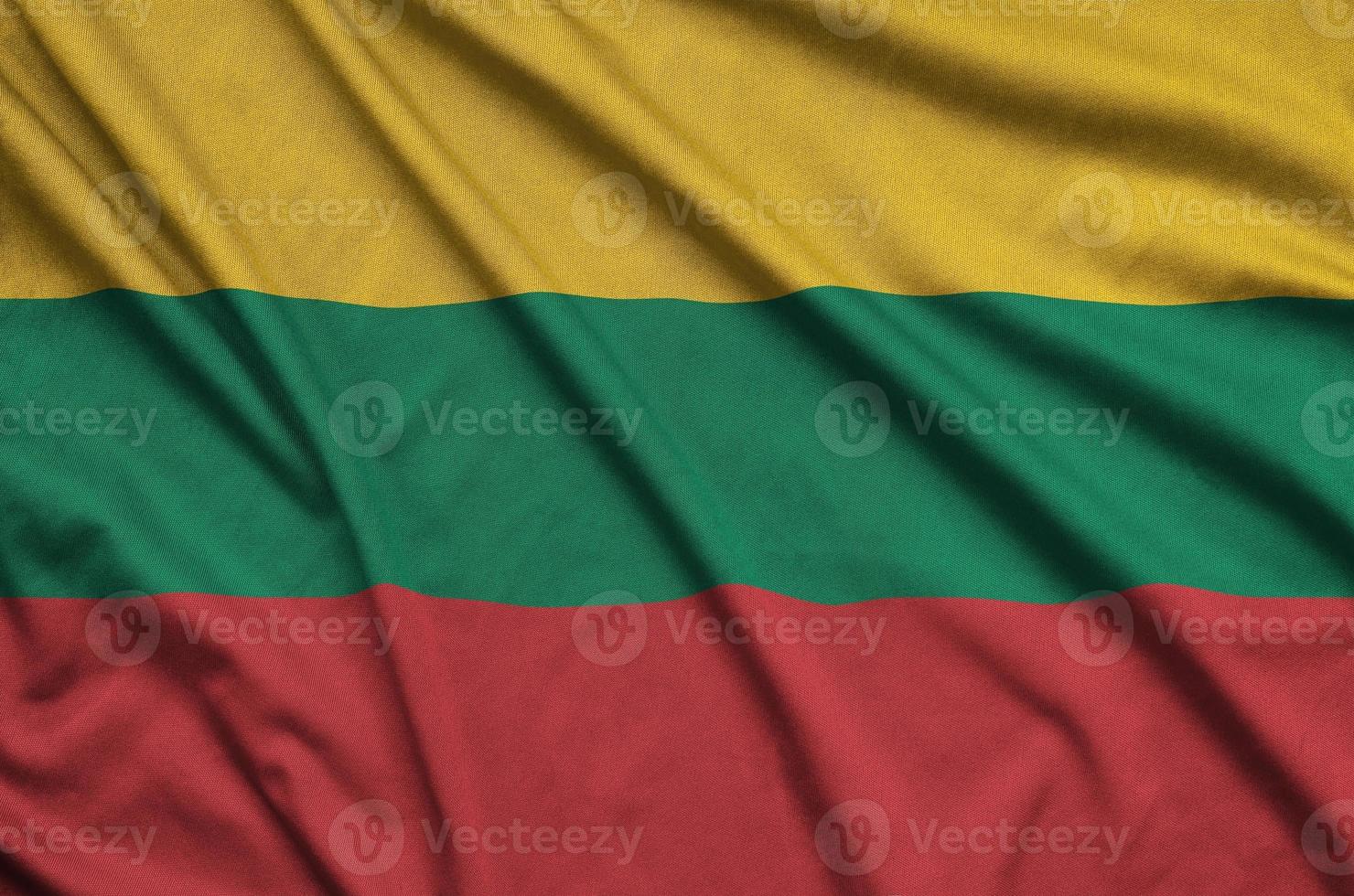 Lithuania flag is depicted on a sports cloth fabric with many folds. Sport team banner photo