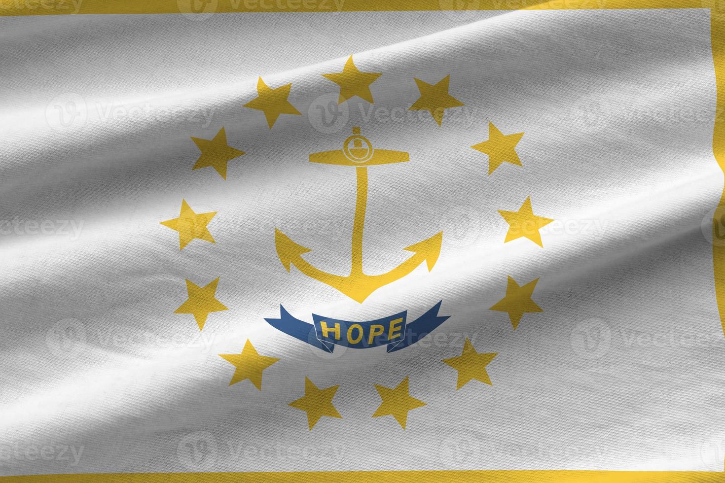 Rhode Island US state flag with big folds waving close up under the studio light indoors. The official symbols and colors in banner photo