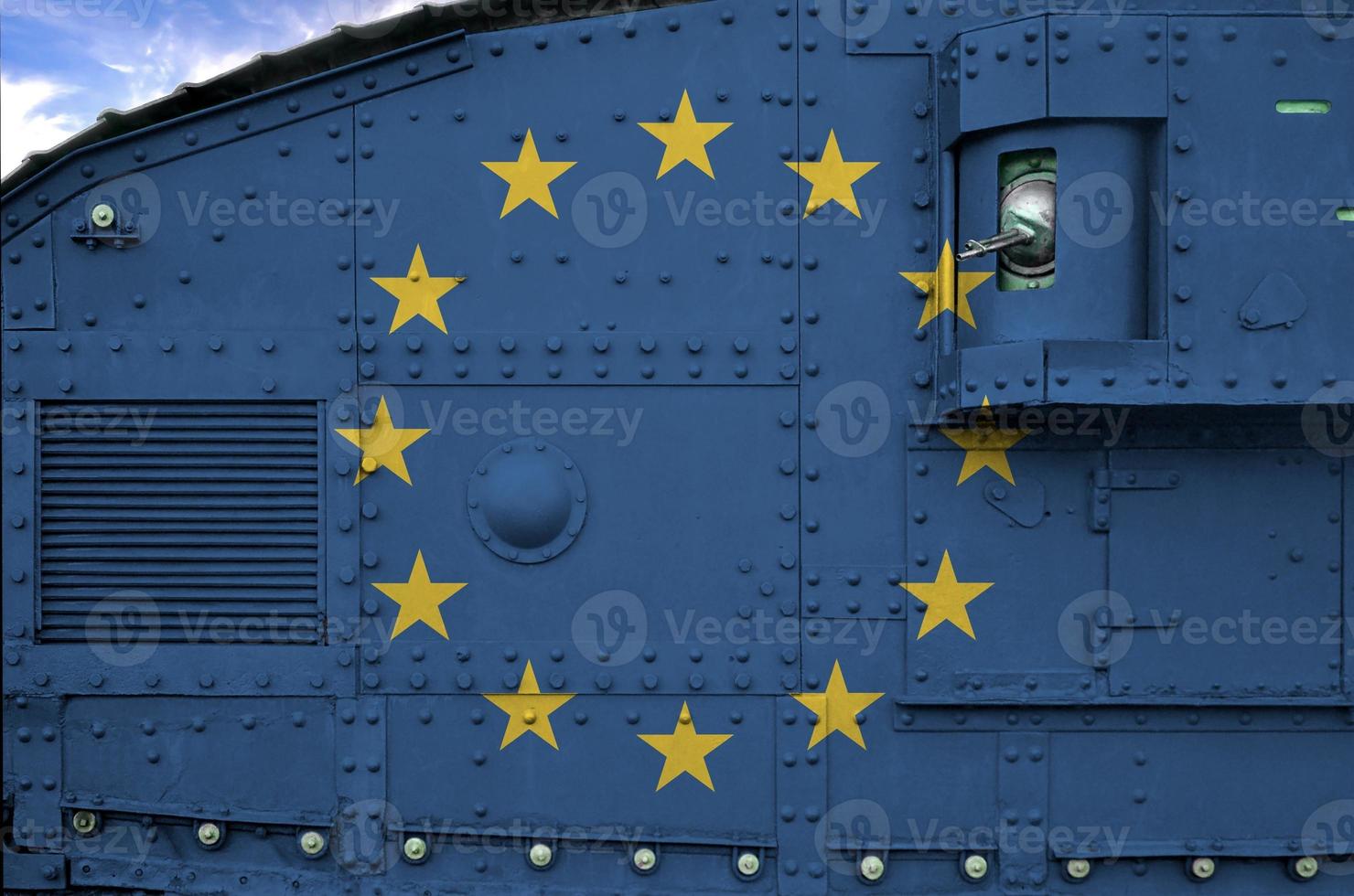 European union flag depicted on side part of military armored tank closeup. Army forces conceptual background photo