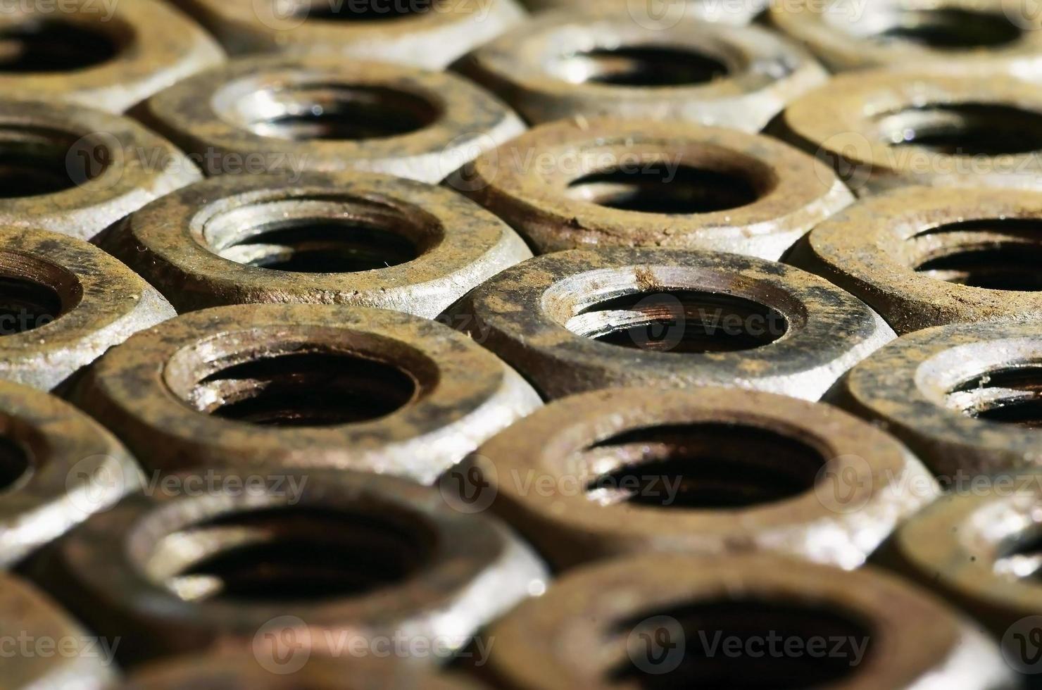 Close-up of rusty nuts photo