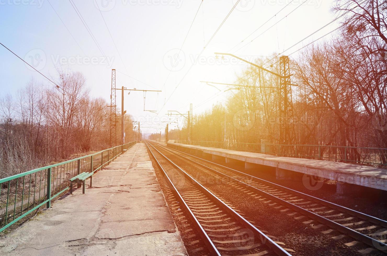 A railway station with platforms for waiting for trains photo
