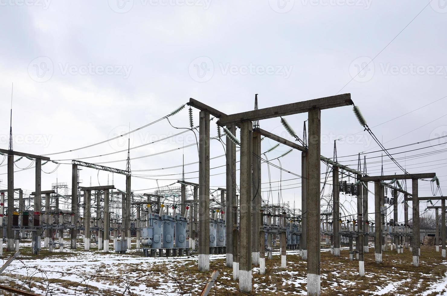 Power plant is a station of transformation. A lot of cables, poles and wires, transformers. Electro-energy. photo