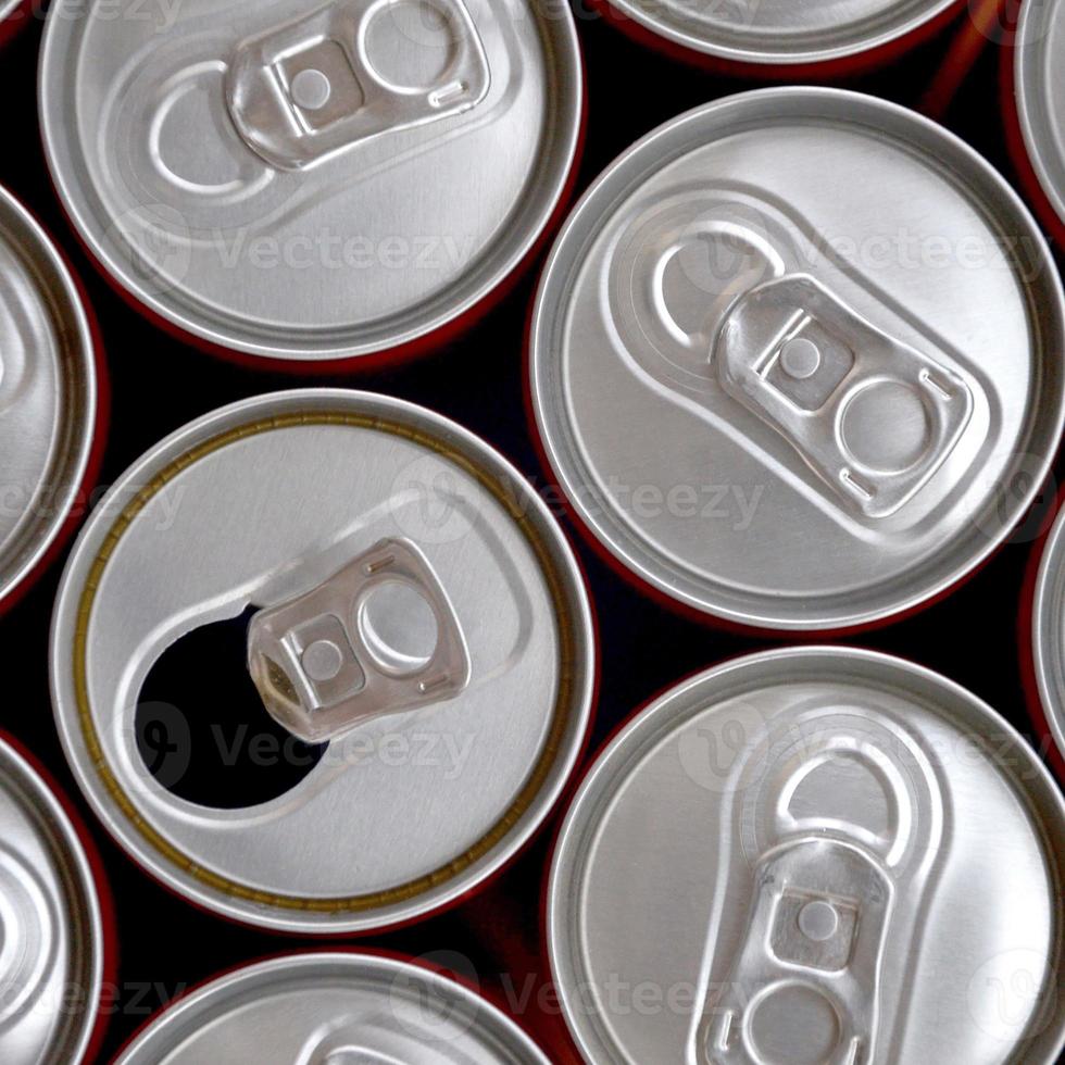 Many cans of soda soft drink or energy drink containers. A lot of