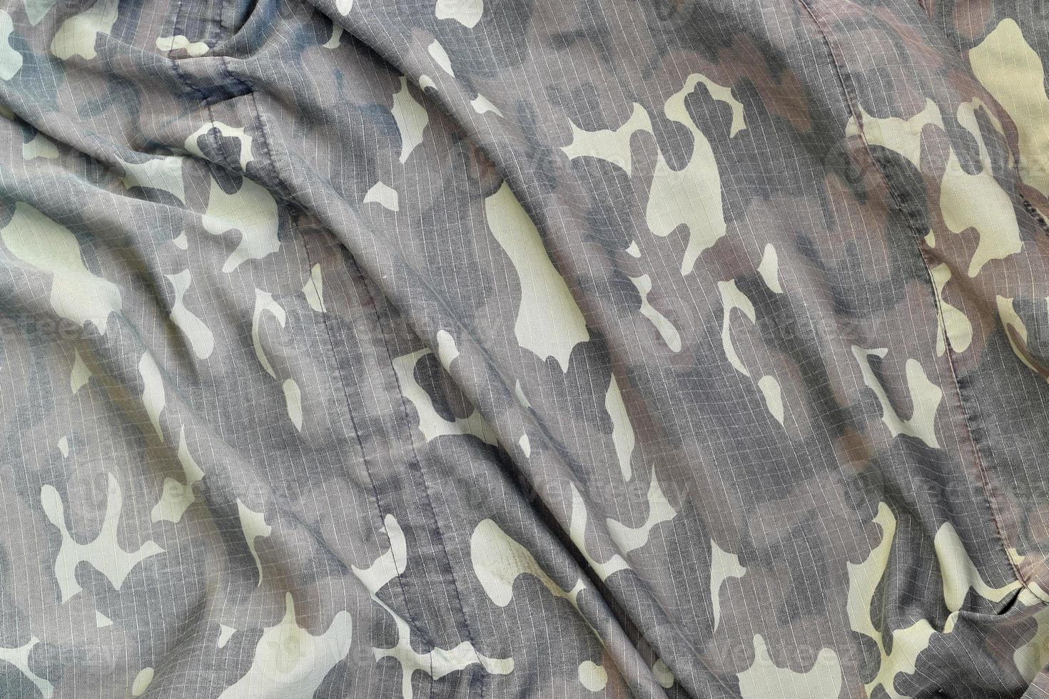 Camouflage background texture as backdrop for military video games and design projects photo