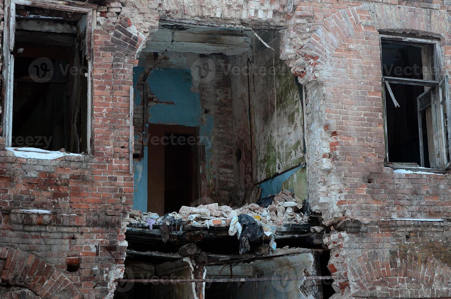 Fragment of an abandoned two-story building after military operations in Donetsk photo