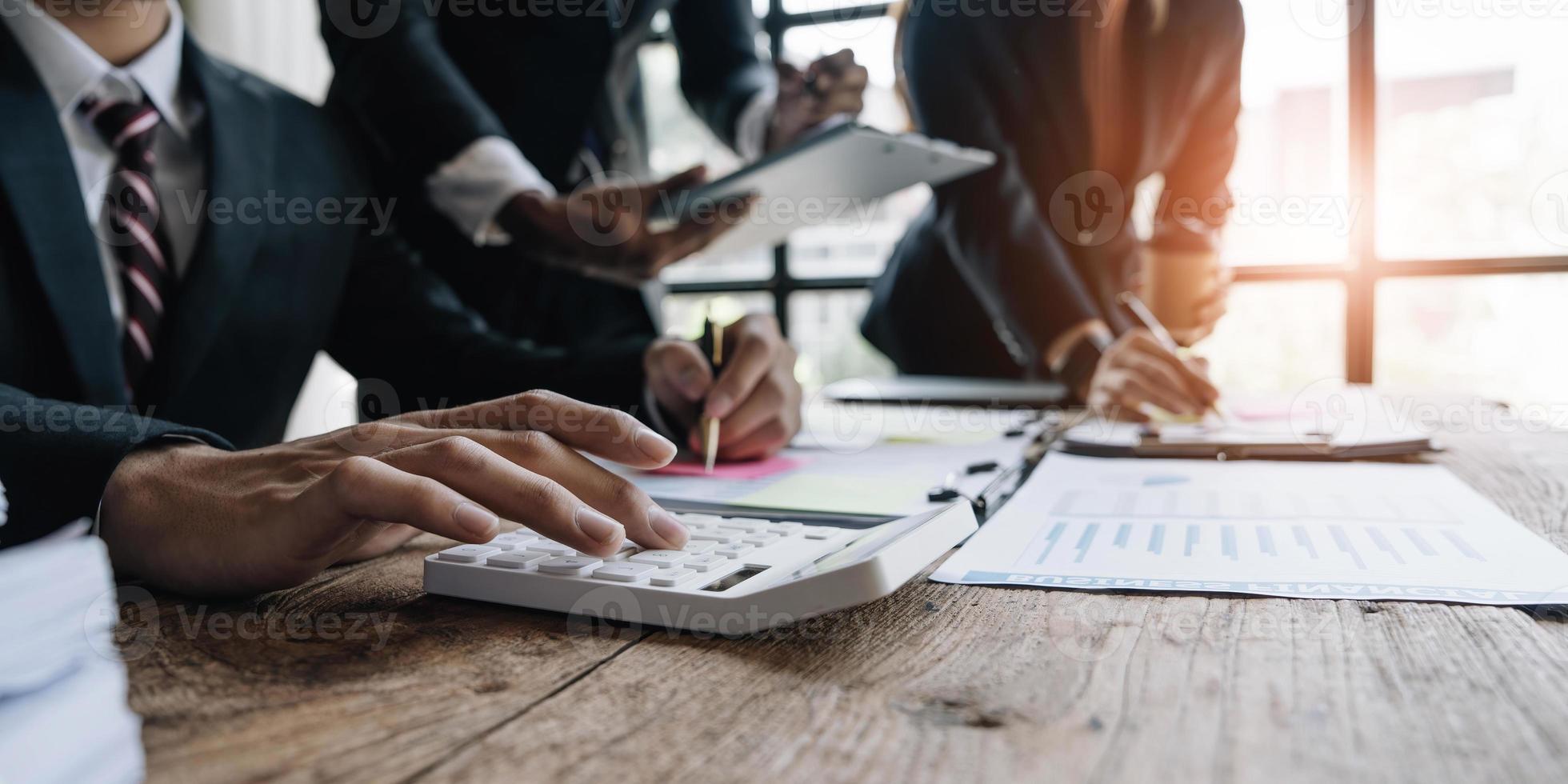 Asian business adviser meeting to analyze and discuss the situation on the financial report in the meeting room.Investment Consultant, Financial advisor and accounting concept photo