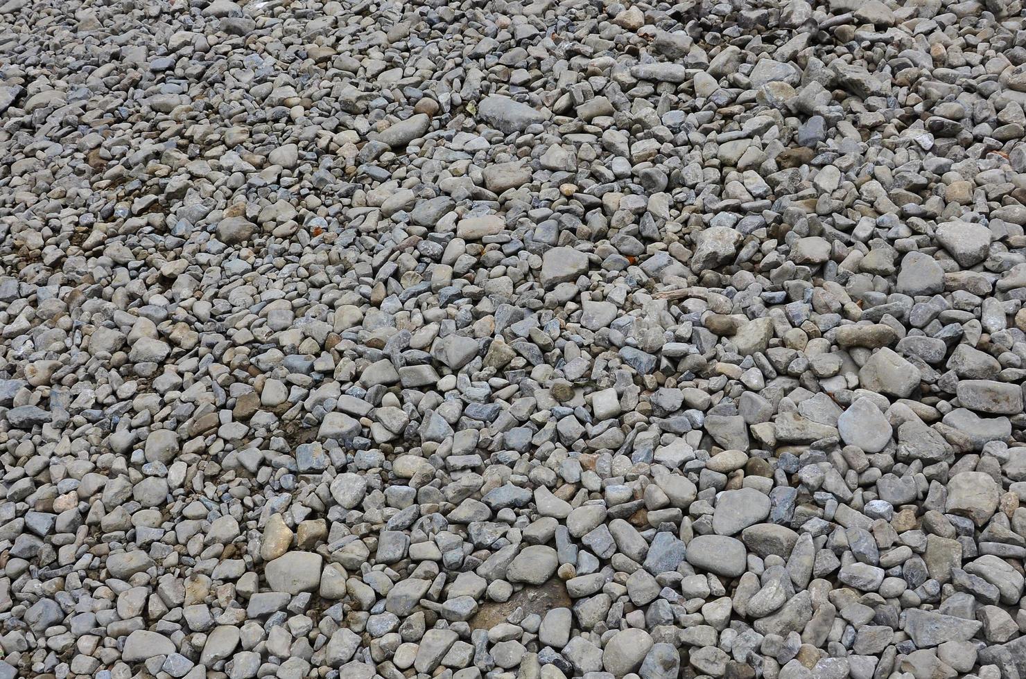 Texture of many crushed stones. Crushed stone is a solid base material for foundation photo