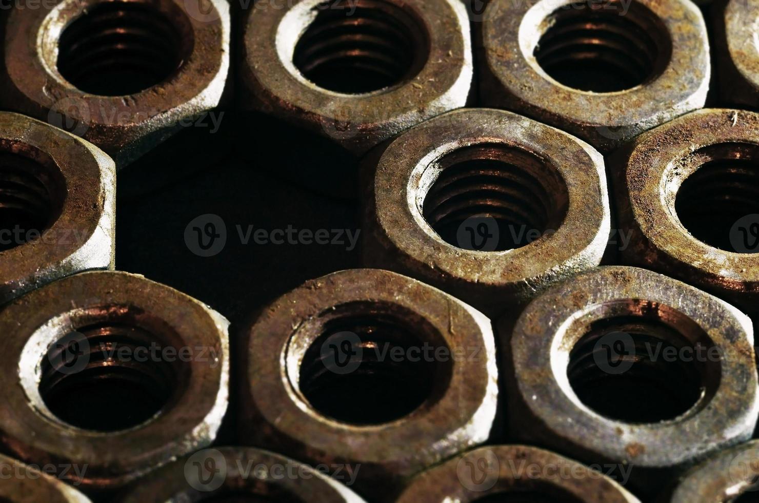 Close-up of rusty nuts photo
