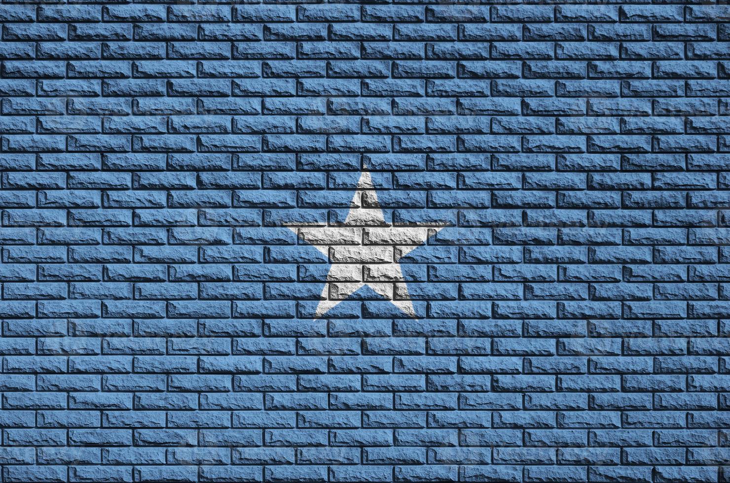 Somalia flag is painted onto an old brick wall photo