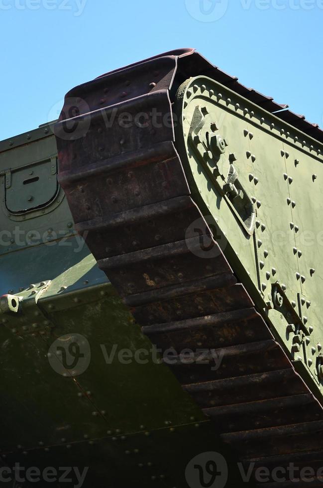 Caterpillars of the green British tank of the Russian Army Wrangel in Kharkov against the blue sky photo