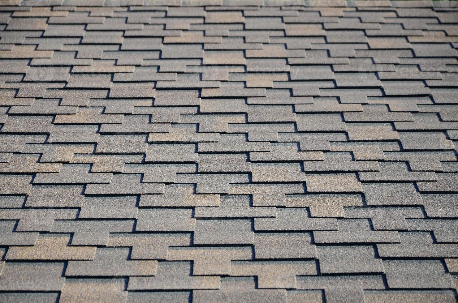 Modern roofing and decoration of chimneys. Flexible bitumen or slate shingles photo