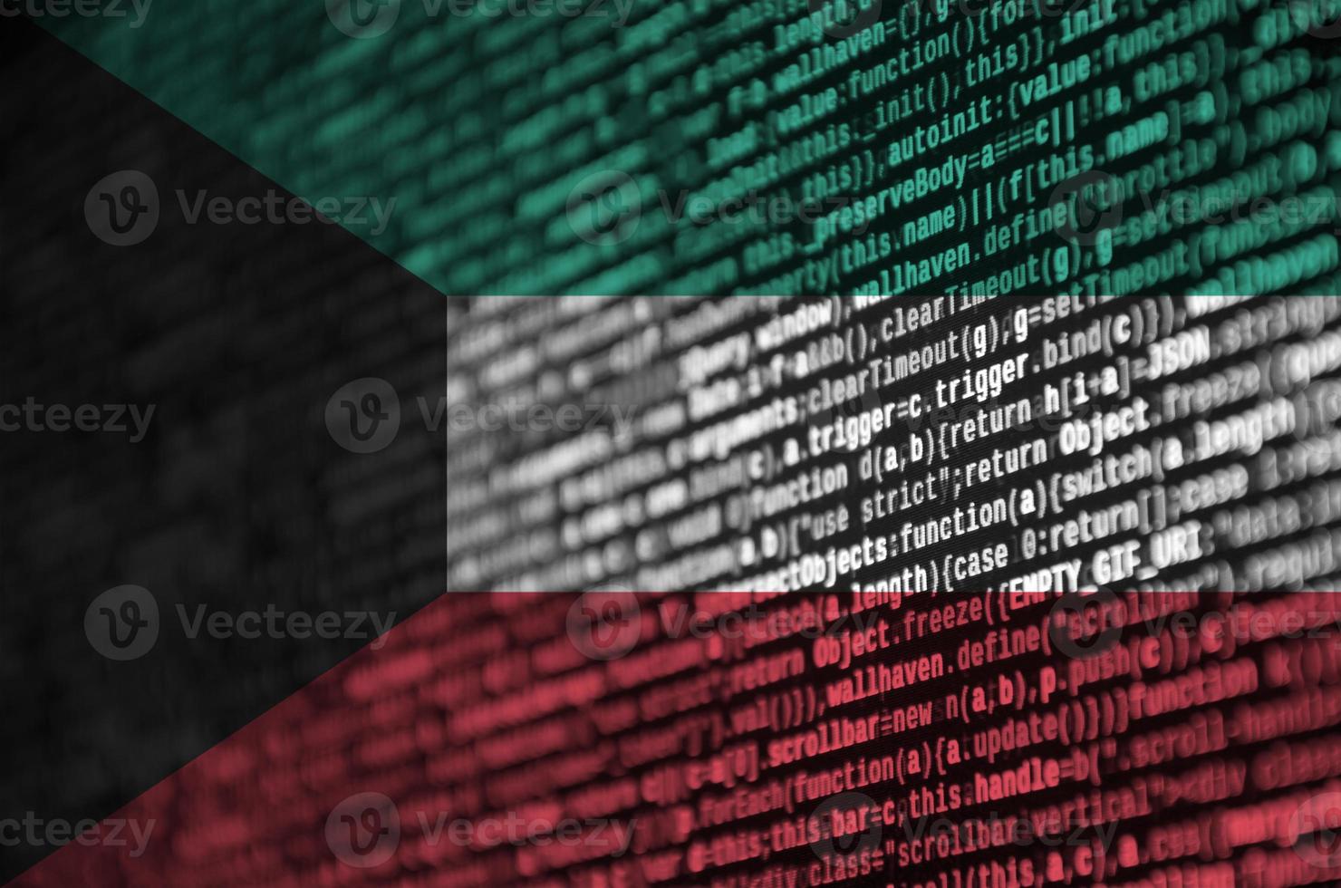 Kuwait flag is depicted on the screen with the program code. The concept of modern technology and site development photo