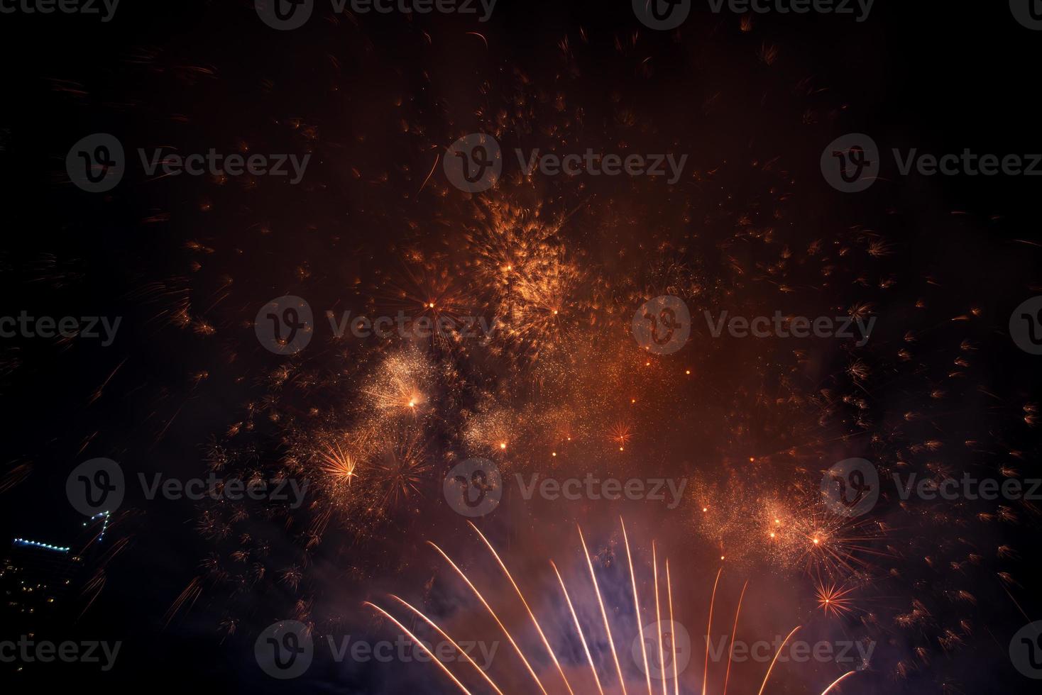 fireworks on the river in the dark sky photo