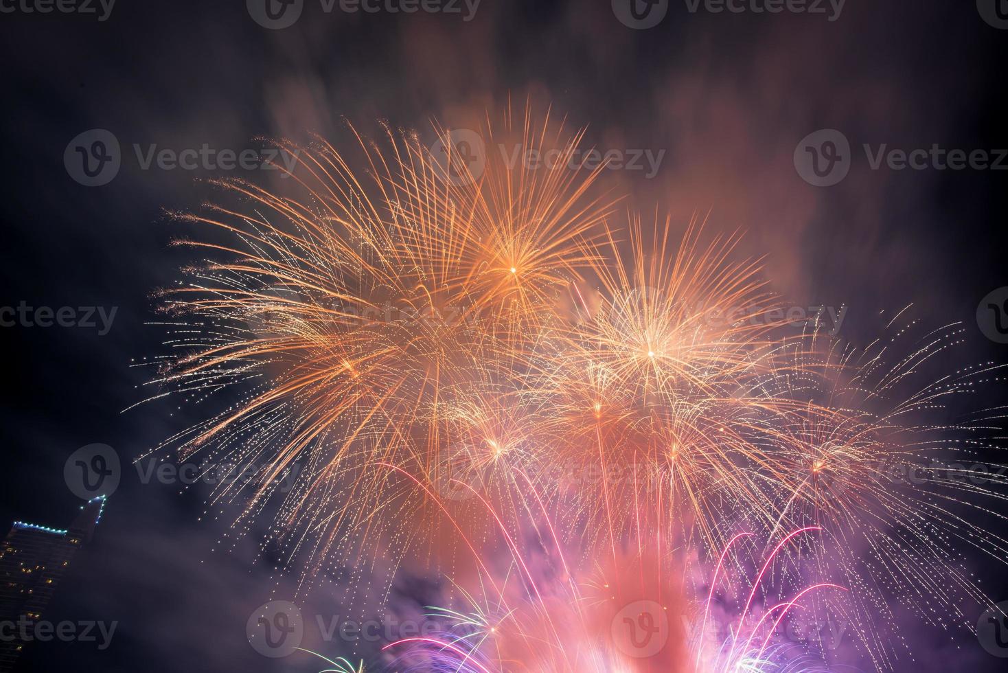 fireworks on the river in the dark sky photo