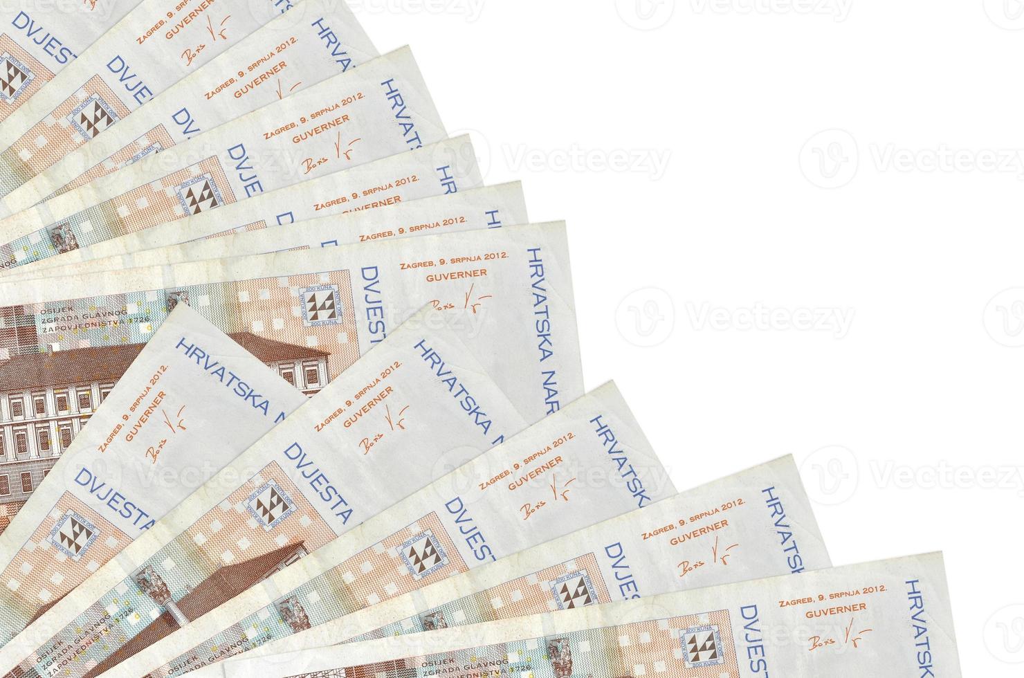 200 Croatian kuna bills lies isolated on white background with copy space stacked in fan close up photo