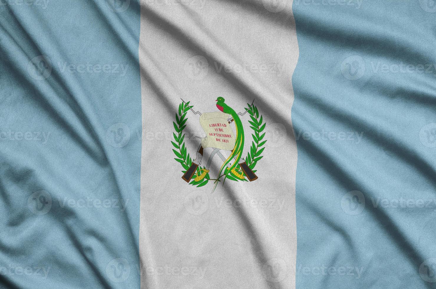 Guatemala flag is depicted on a sports cloth fabric with many folds. Sport team banner photo