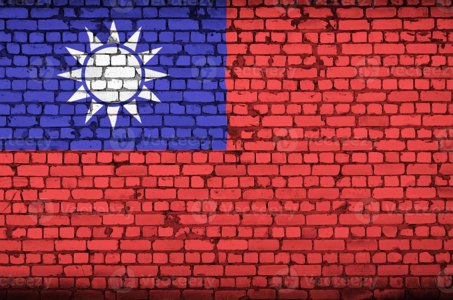 Taiwan flag is painted onto an old brick wall photo