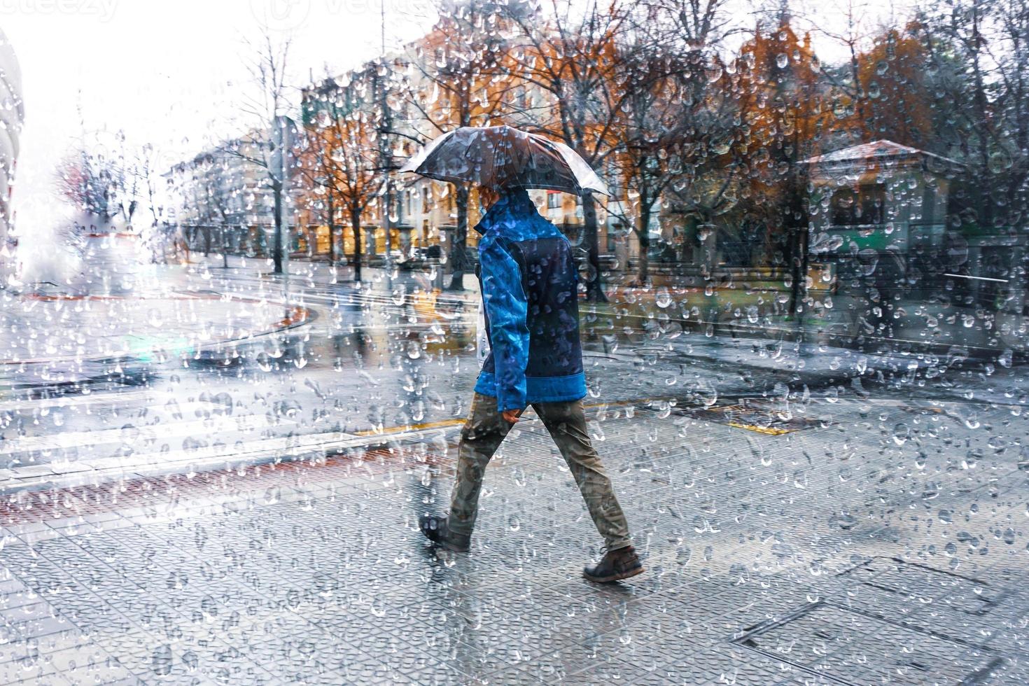 people with an umbrella in rainy days in Bilbao city, basque country, spain photo