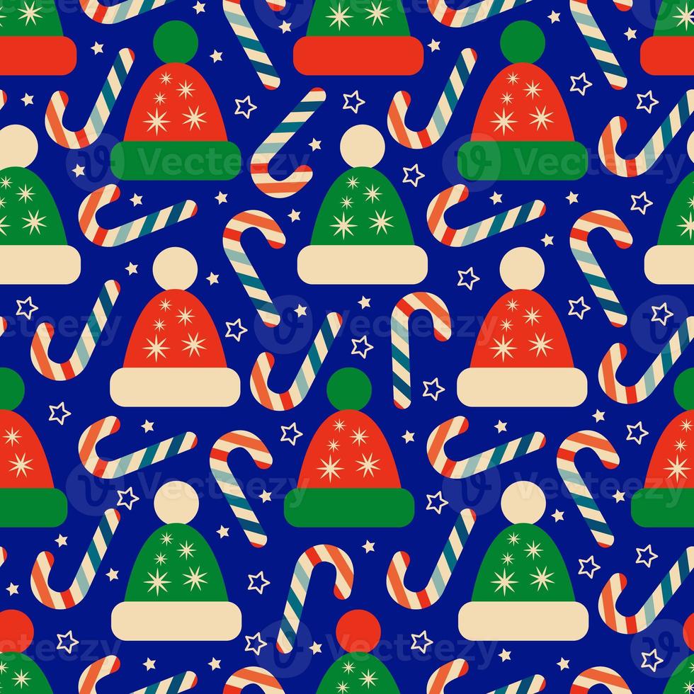 Seamless Christmas pattern with winter Hats and candy canes photo