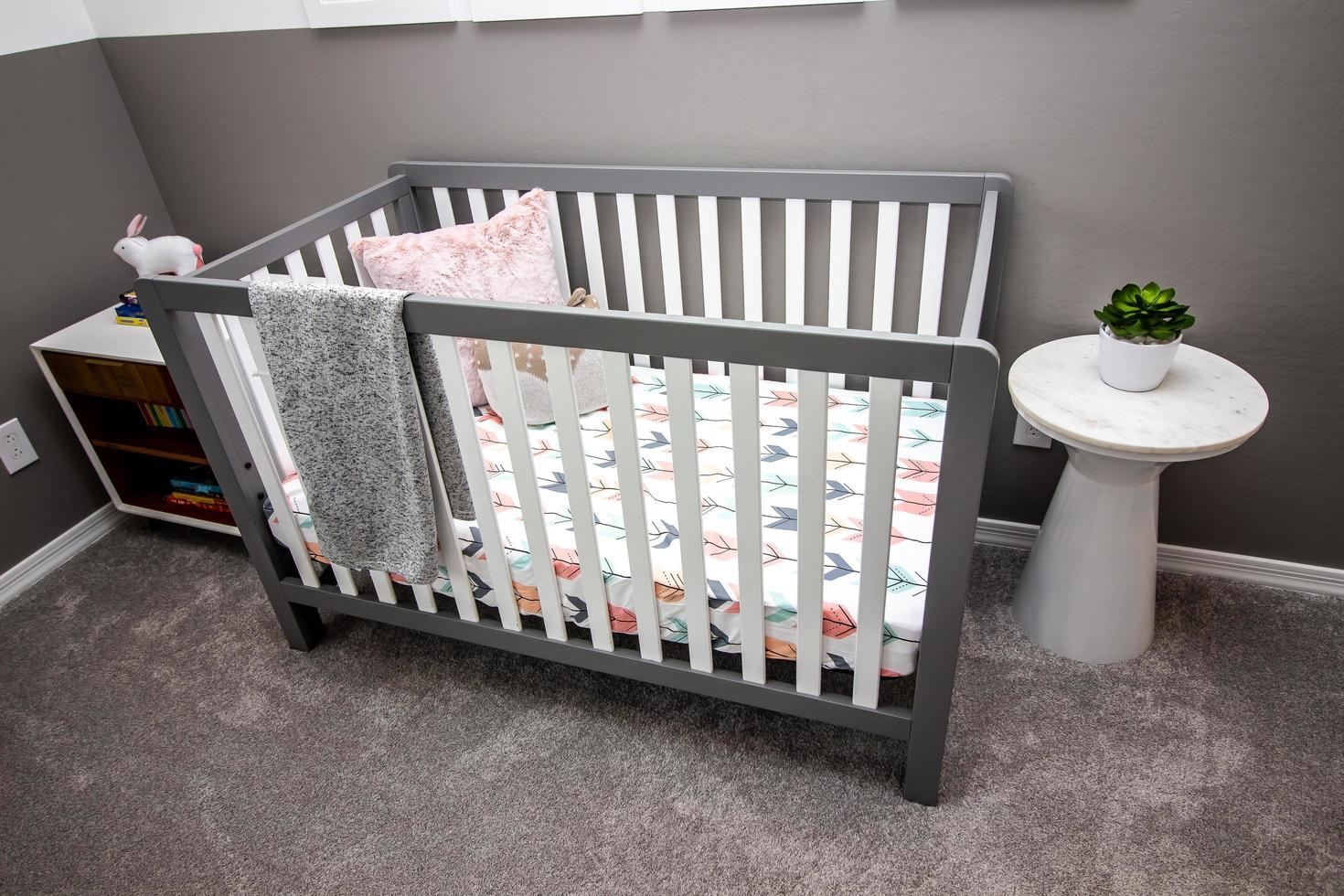 Baby Crib With White Slats And Colorful Matterss 13809135 Stock Photo