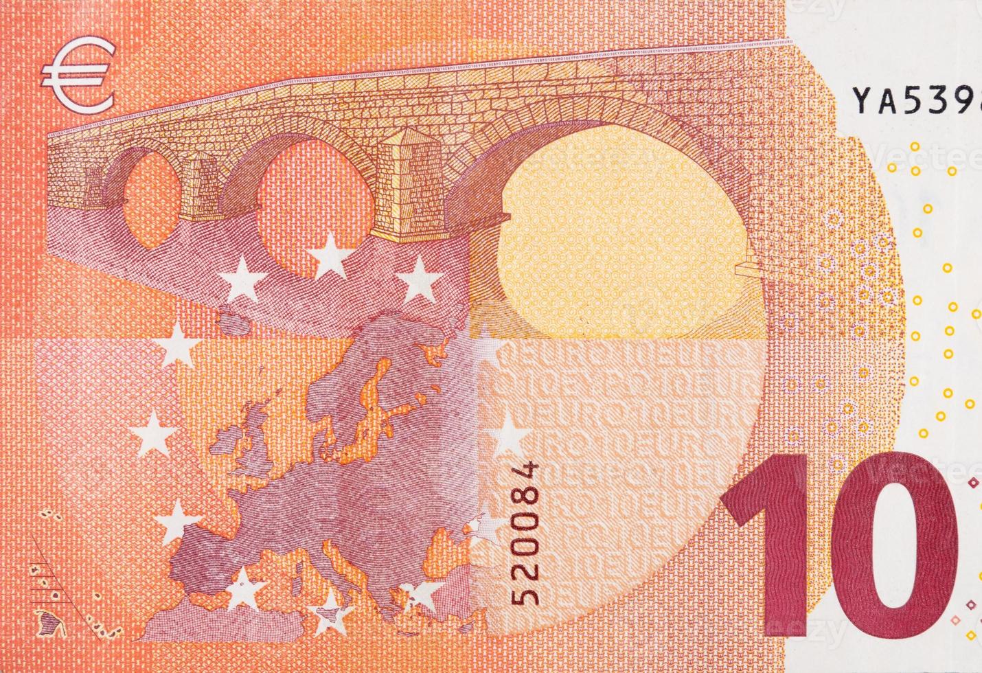 Fragment part of 10 euro banknote close-up with small red details photo