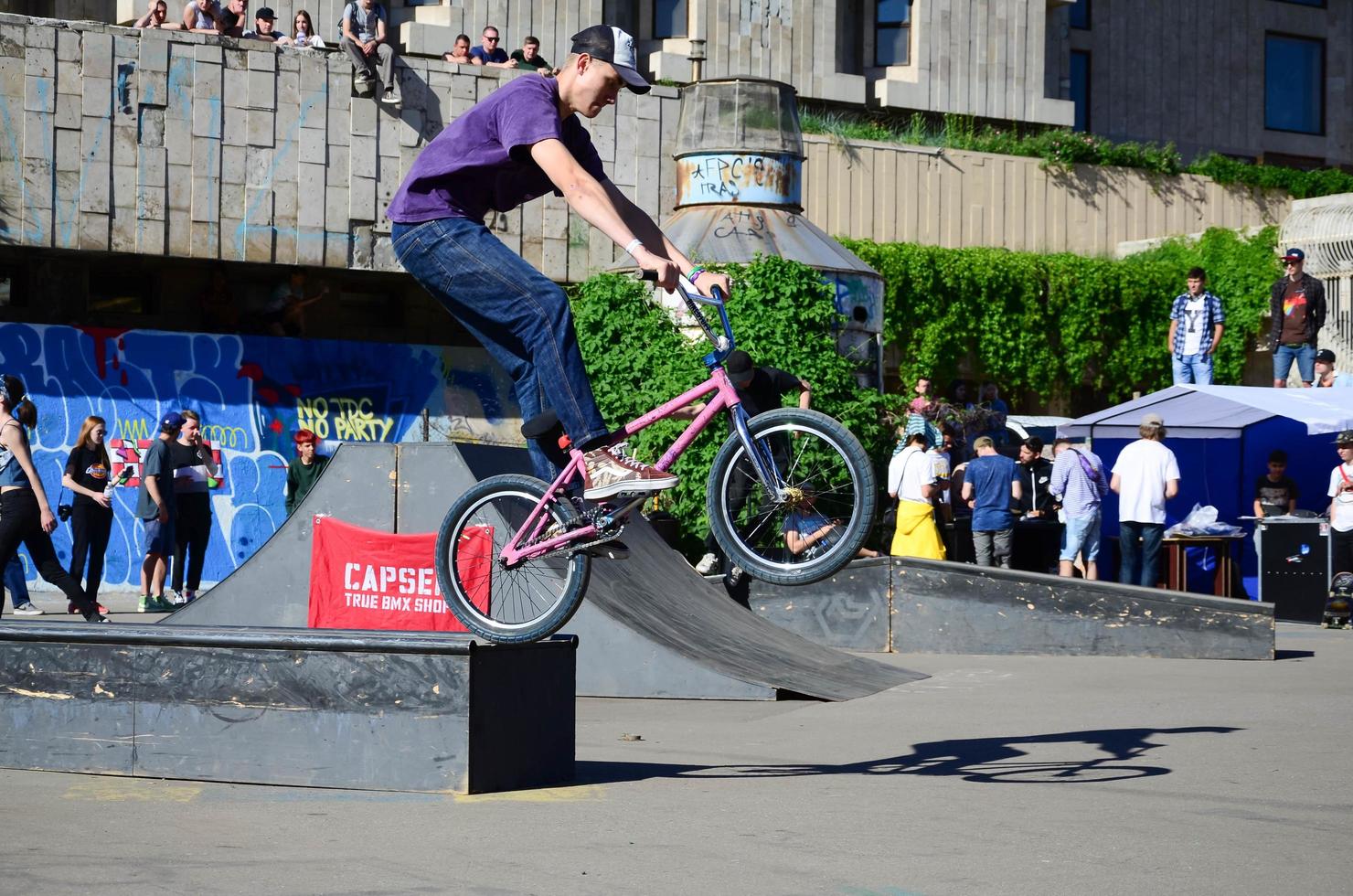 KHARKIV, UKRAINE - 27 MAY, 2018 Freestyle BMX riders in a skatepark during the annual festival of street cultures photo