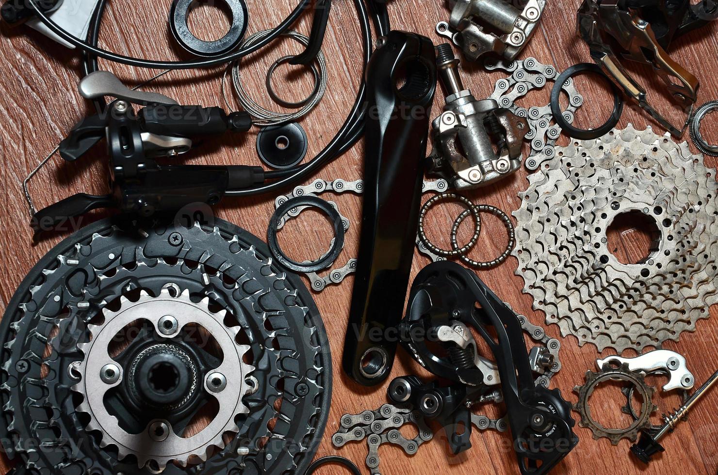 Many different metal parts and components of the running gear of a sports bike photo