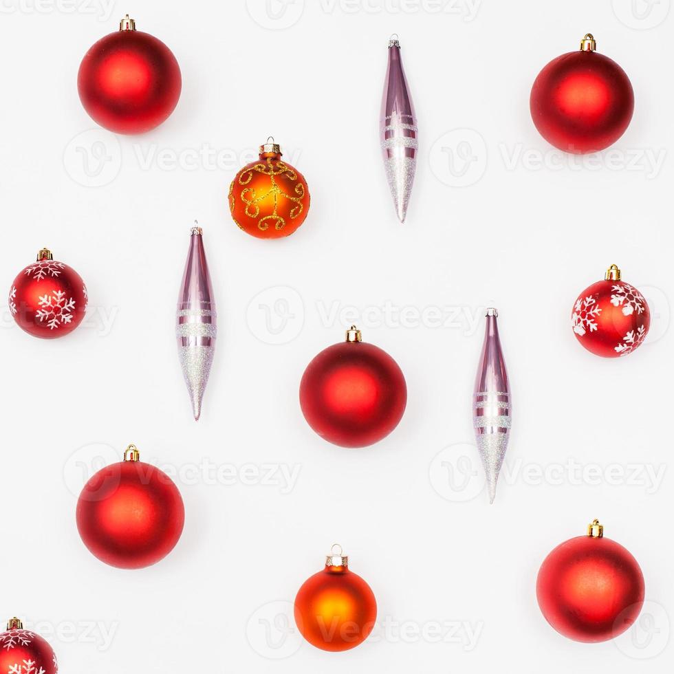 various christmas balls and glass icicles on white photo