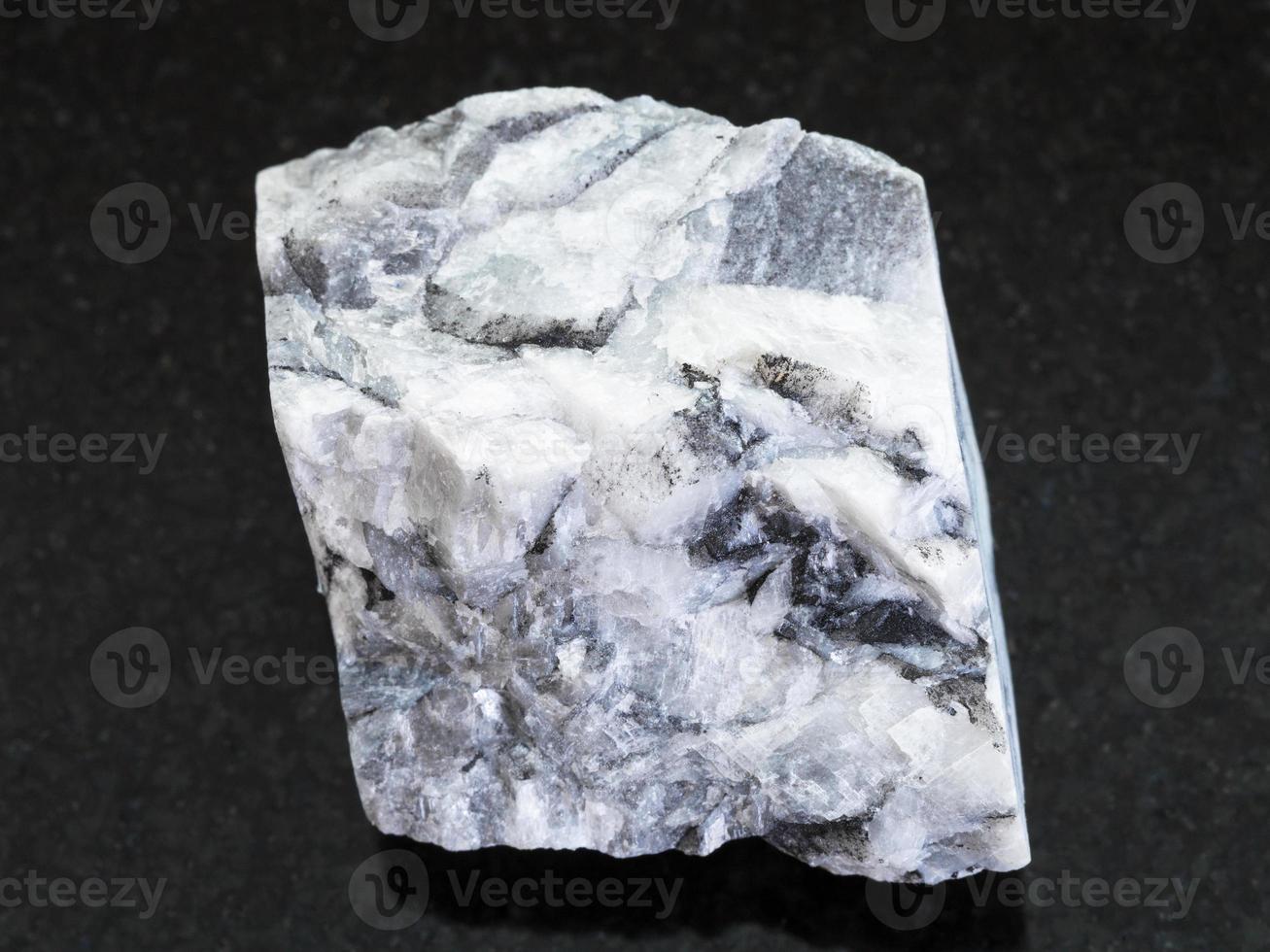 rough magnesite stone on dark background 13824261 Stock Photo at Vecteezy