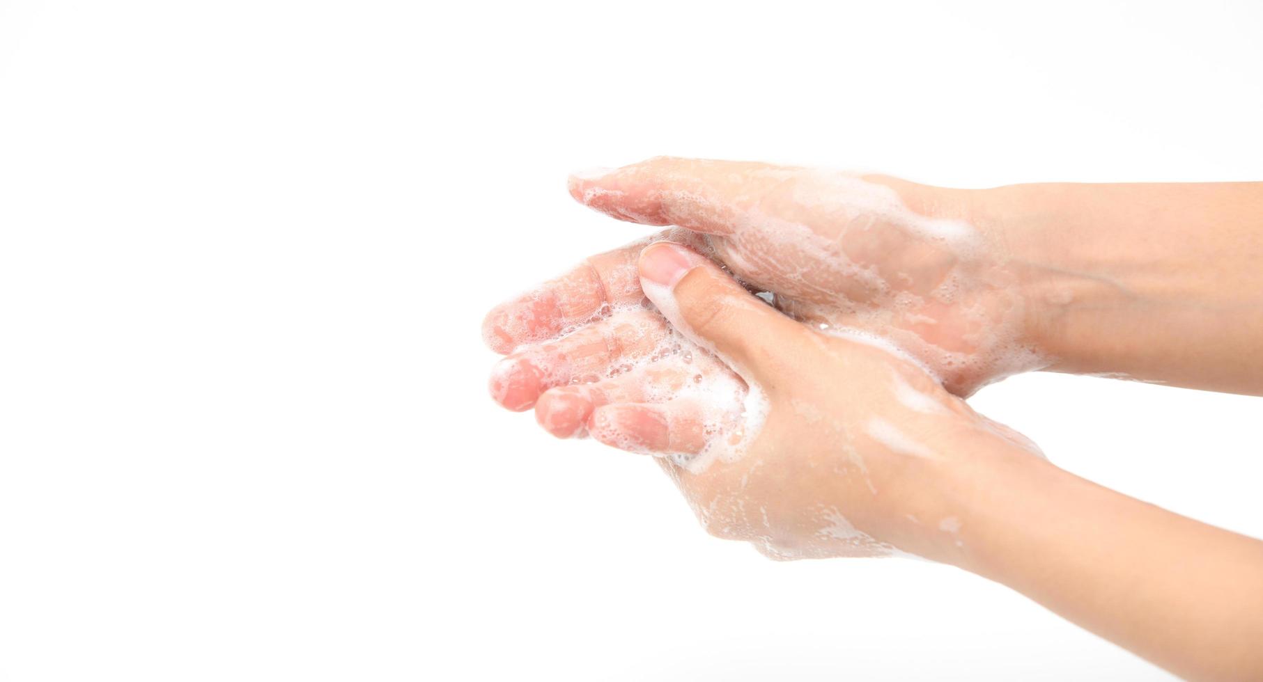 Woman use soap and washing hands isolated on white background photo