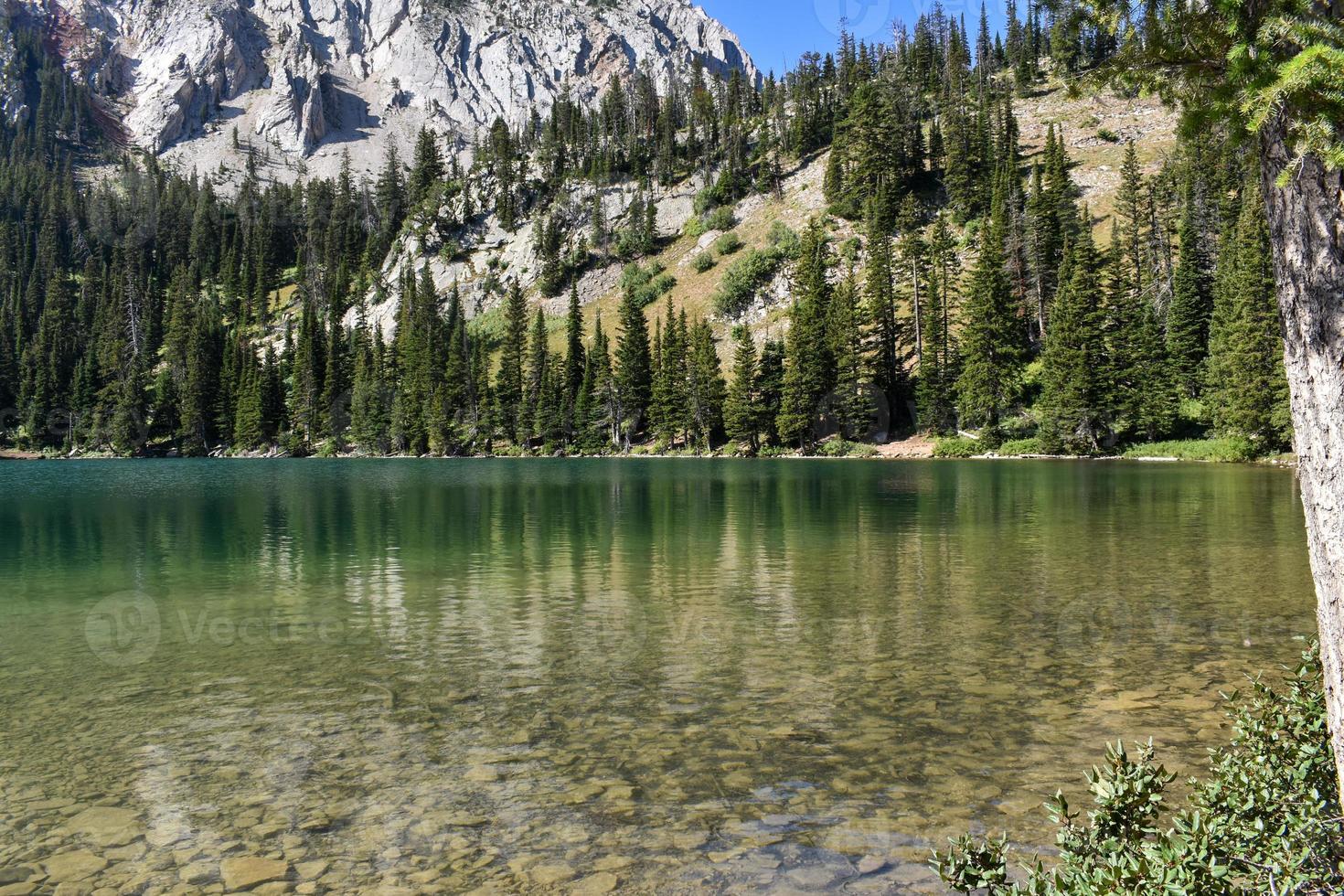 Beautiful Azure Blue Mountain Lake in Montana photo